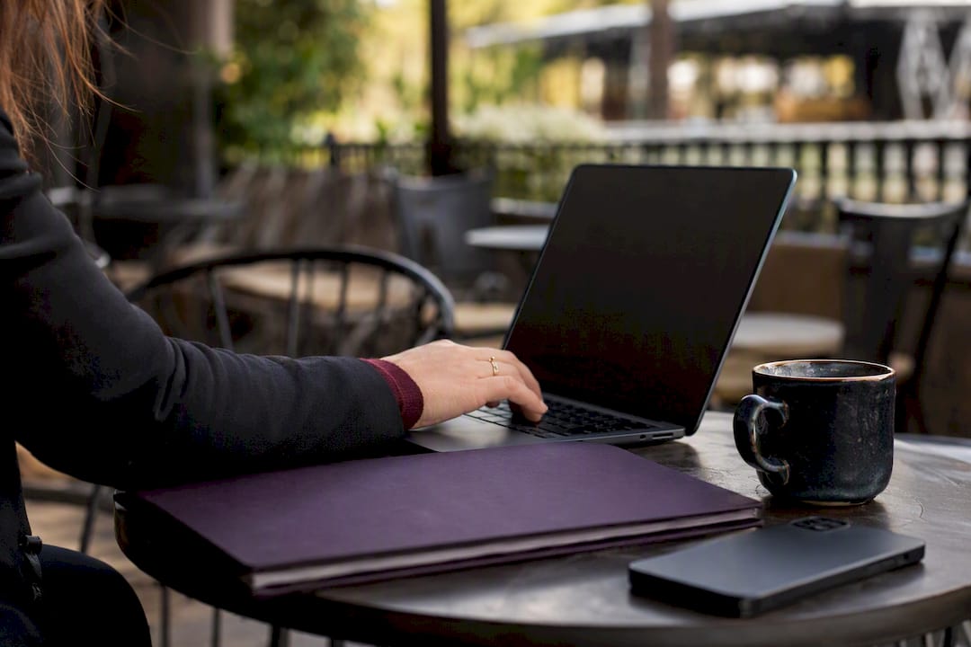 Hand entering GSA contract number on laptop