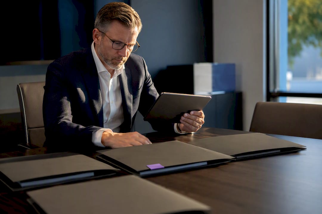 SaaS executive reviewing pricing preparation materials