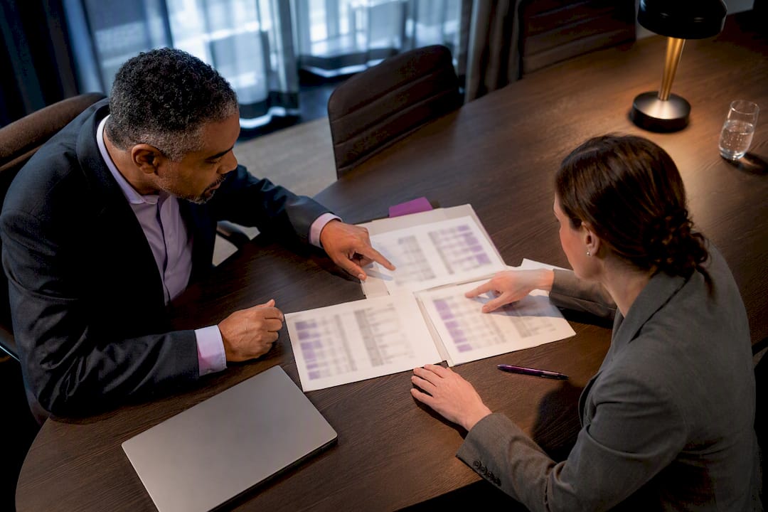 Pricing negotiation materials on conference table