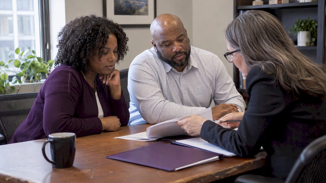 Business partners reviewing a joint venture offer